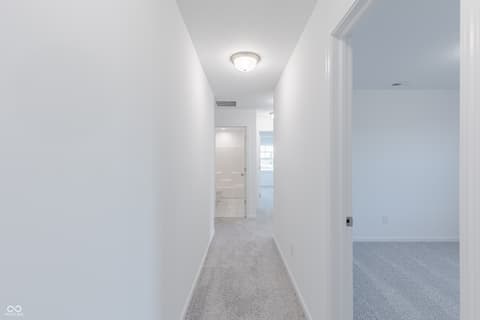 Hallway at 15752 Showdown Road, Noblesville, IN — Bright, clean hallway with modern finishes throughout.