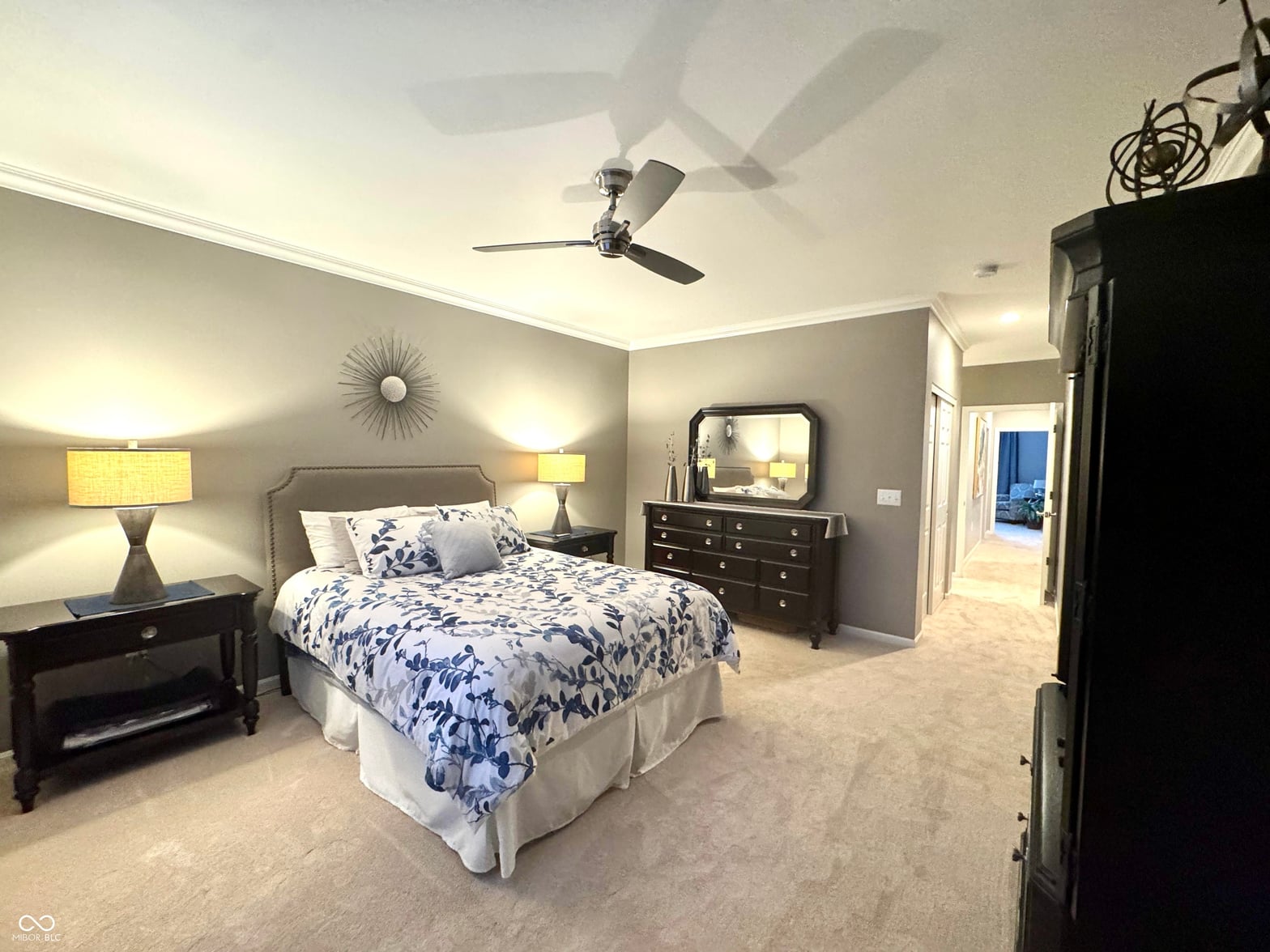 Spacious primary suite with generous closet and modern lighting.