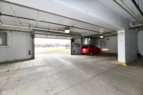 Garage at 20971 Shoreline Court, Noblesville, IN — Spacious two-car garage with utility area and storage.