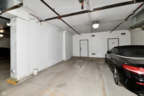 Garage at 20971 Shoreline Court, Noblesville, IN — Single garage space with overhead door and storage.