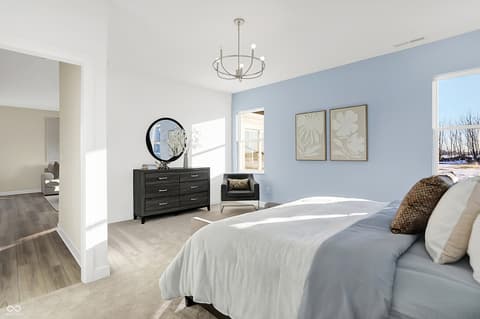 Primary bedroom at 15498 Postman Road, Fishers, IN — Bright primary bedroom with en-suite and modern finishes.