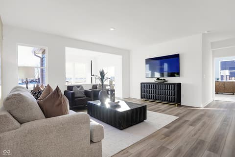 Living room at 15498 Postman Road, Fishers, IN — Bright, contemporary living space with expansive windows.