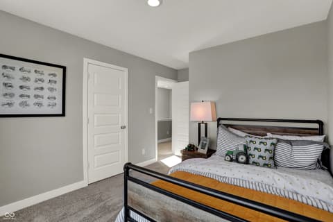 Bedroom at 12961 South Rim Drive, Noblesville, IN — Bright, updated bedroom with ensuite bathroom access.