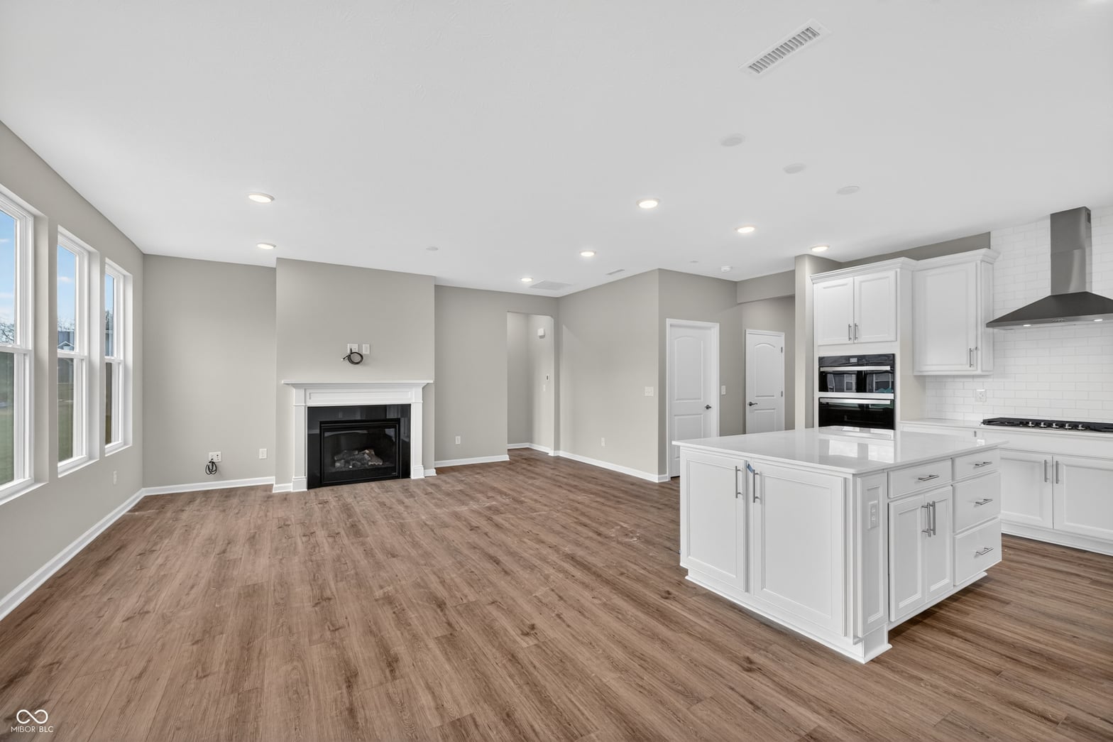 Bright open concept with fireplace and updated kitchen.