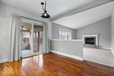 Living room at 792 Grace Drive, Carmel, IN — Bright living room with fireplace and direct deck access.