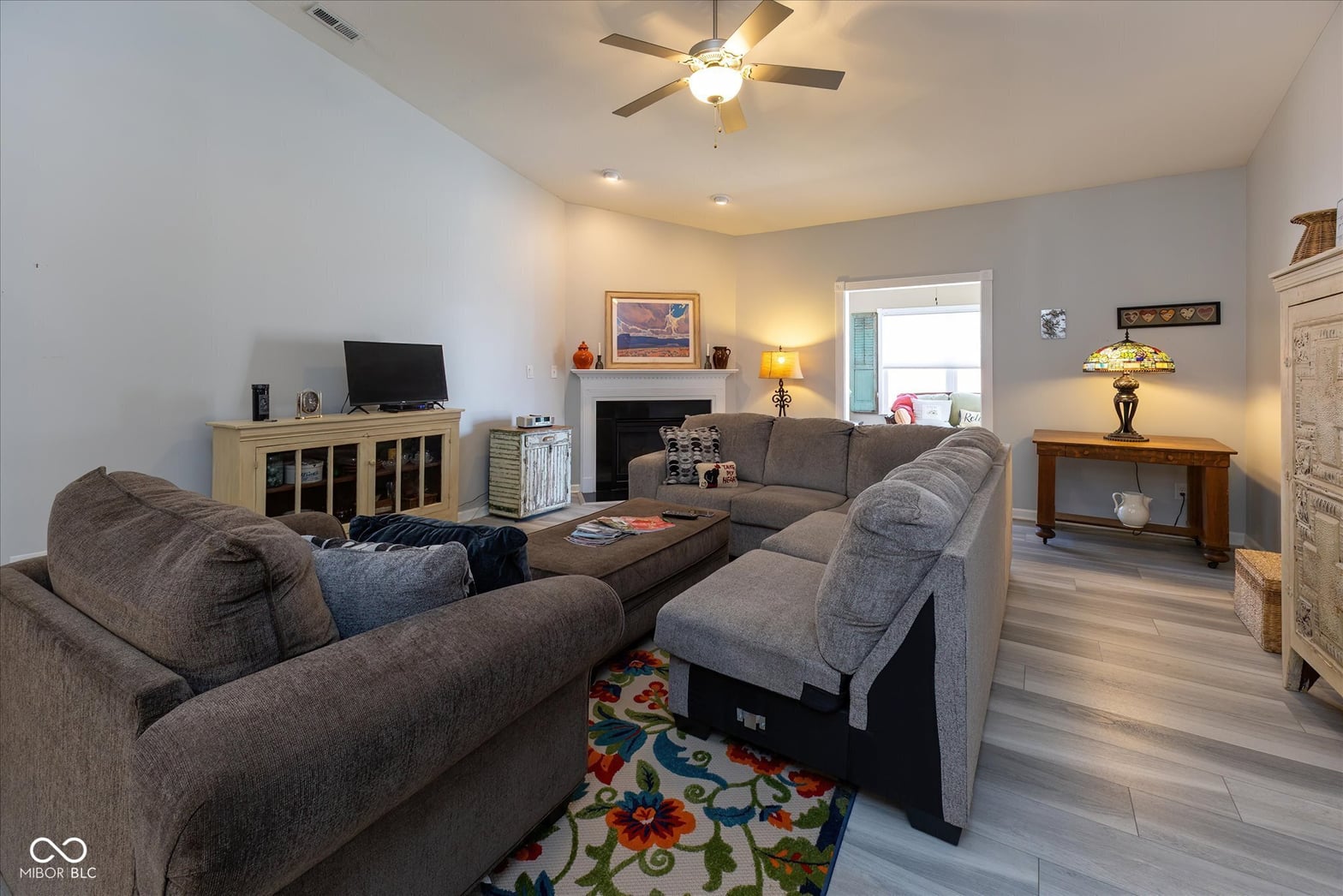 Spacious family room with fireplace and modern updates.