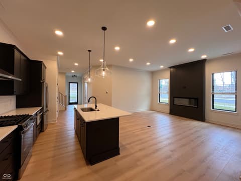 Kitchen at 16518 Deerpath Way, Westfield, IN — Stunning modern kitchen with island and open concept living.
