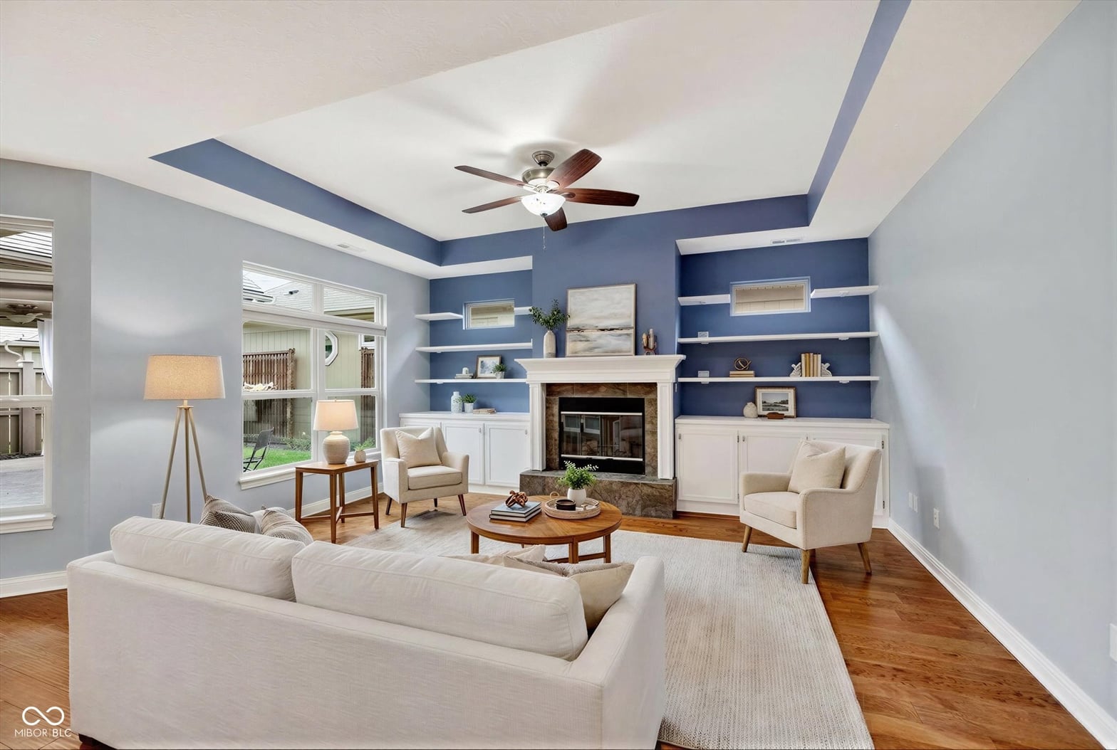 Spacious living room with fireplace and custom built-ins.