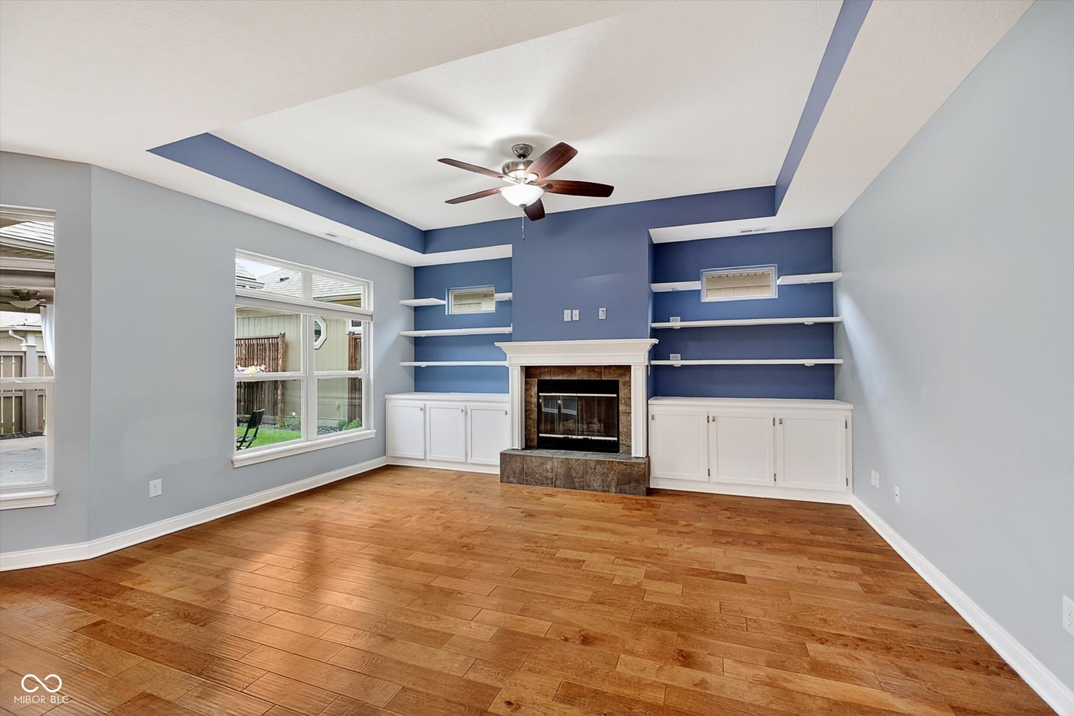 Updated family room with fireplace and custom built-ins.