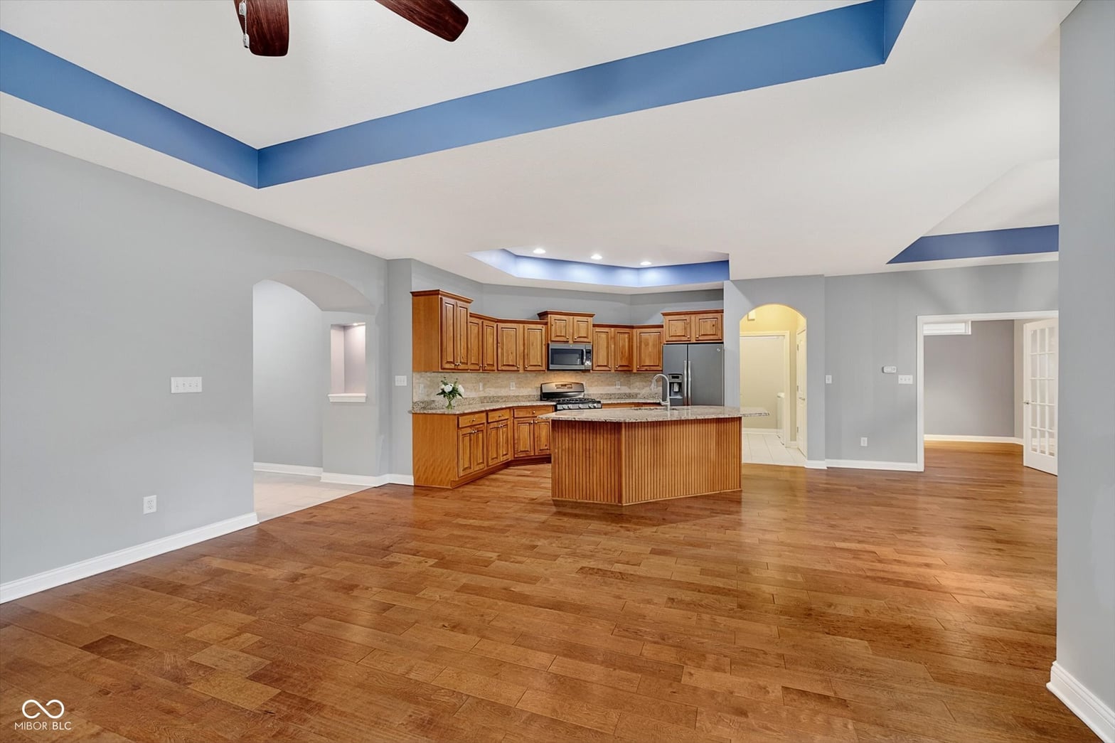 Spacious kitchen with vaulted ceilings and modern updates.