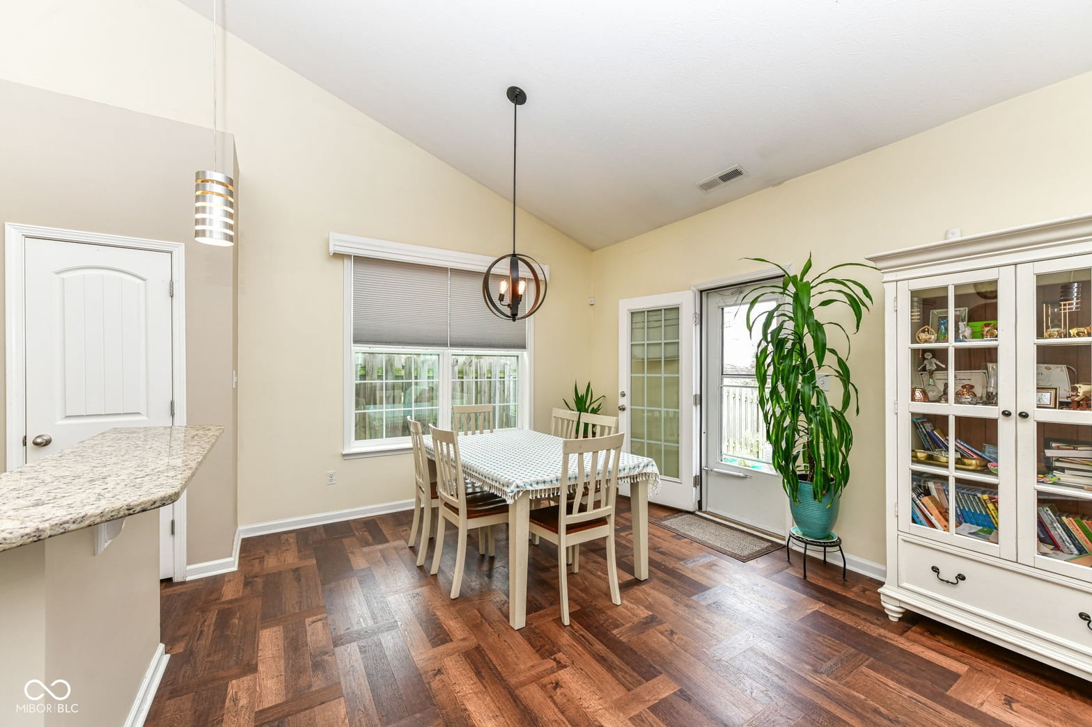Bright dining area with hardwood floors and built-ins.