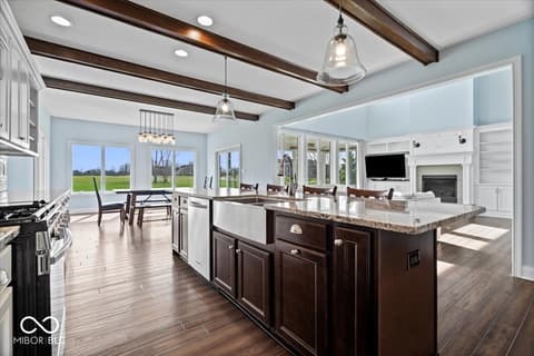 Kitchen at 16540 Shore Oaks Court, Noblesville, IN — Modern kitchen with exposed beams and countryside views.