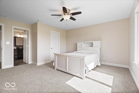 Primary bedroom at 16540 Shore Oaks Court, Noblesville, IN — Spacious primary bedroom with ensuite and natural light.