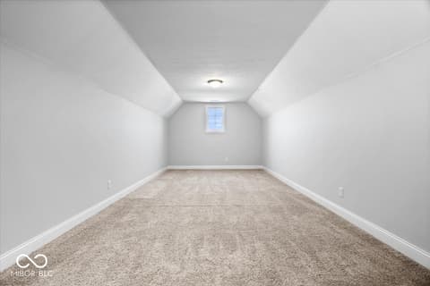 Bonus room at 16540 Shore Oaks Court, Noblesville, IN — Bright, spacious bonus room with vaulted ceilings.