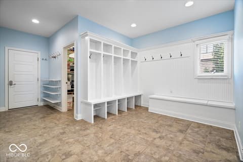 Mudroom at 16540 Shore Oaks Court, Noblesville, IN — Luxurious mudroom with custom built-in storage cubbies.