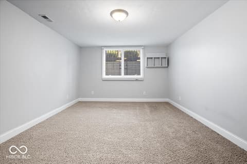 Bedroom at 16540 Shore Oaks Court, Noblesville, IN — Bright bedroom with fresh carpet and ample natural light.