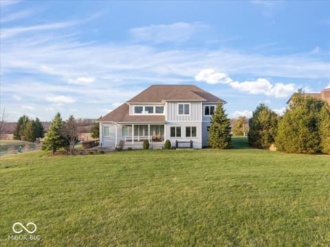 Front exterior at 16540 Shore Oaks Court, Noblesville, IN — Stunning new farmhouse on expansive manicured grounds.