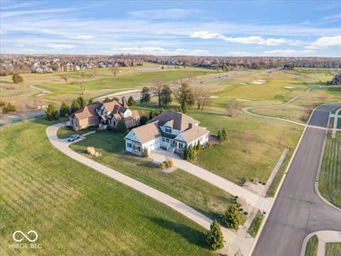 Aerial view at 16540 Shore Oaks Court, Noblesville, IN — Stunning aerial view of elegant home on expansive lot.