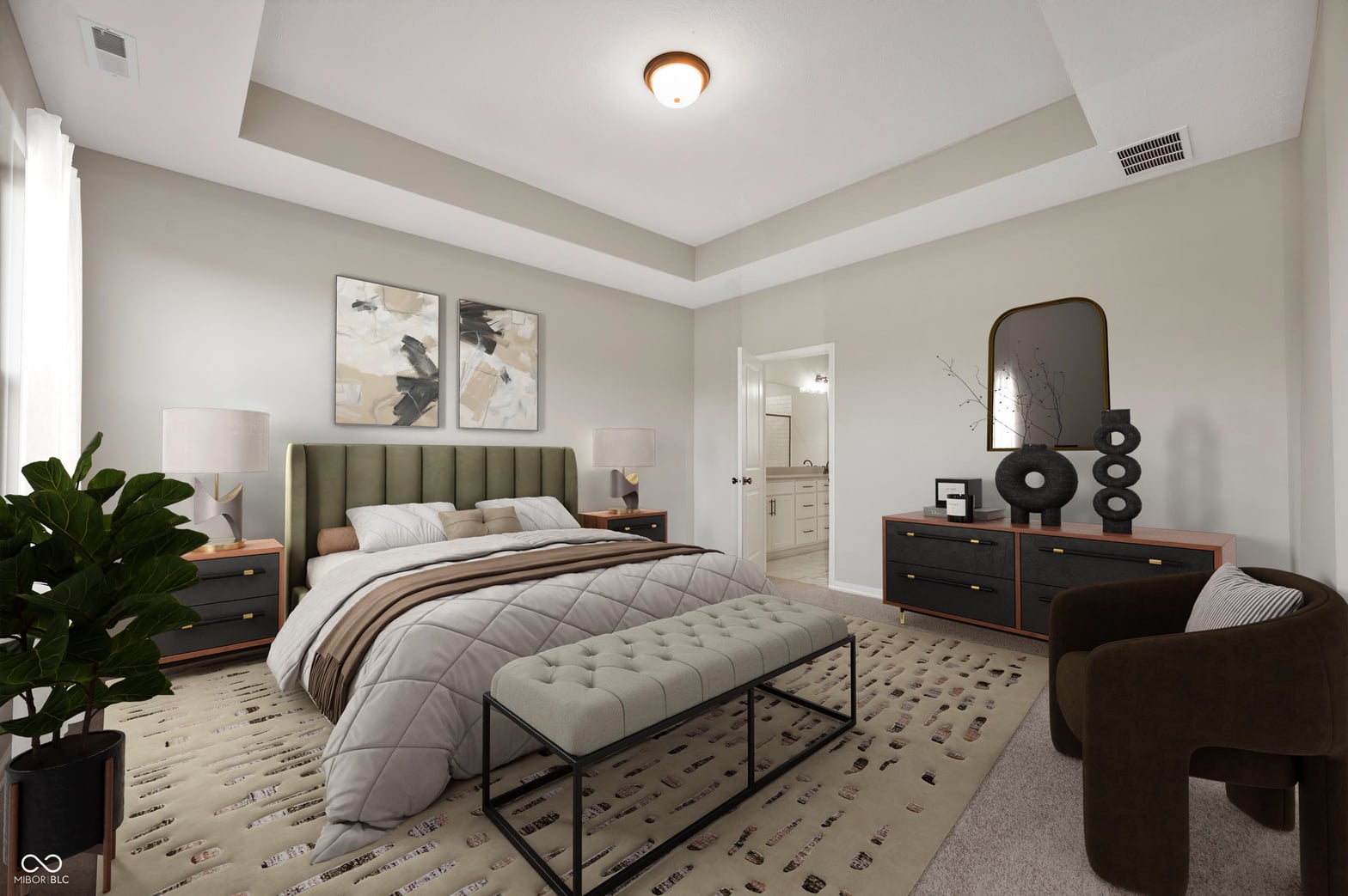 Luxurious primary suite with tray ceiling and ensuite.