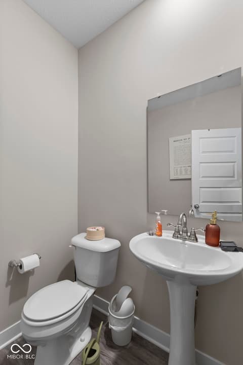 Bathroom at 16352 Sedalia Drive, Fishers, IN — Clean, updated bathroom with modern pedestal sink setup.