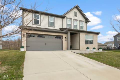 Front exterior at 16352 Sedalia Drive, Fishers, IN — New contemporary home with two-car garage and driveway.