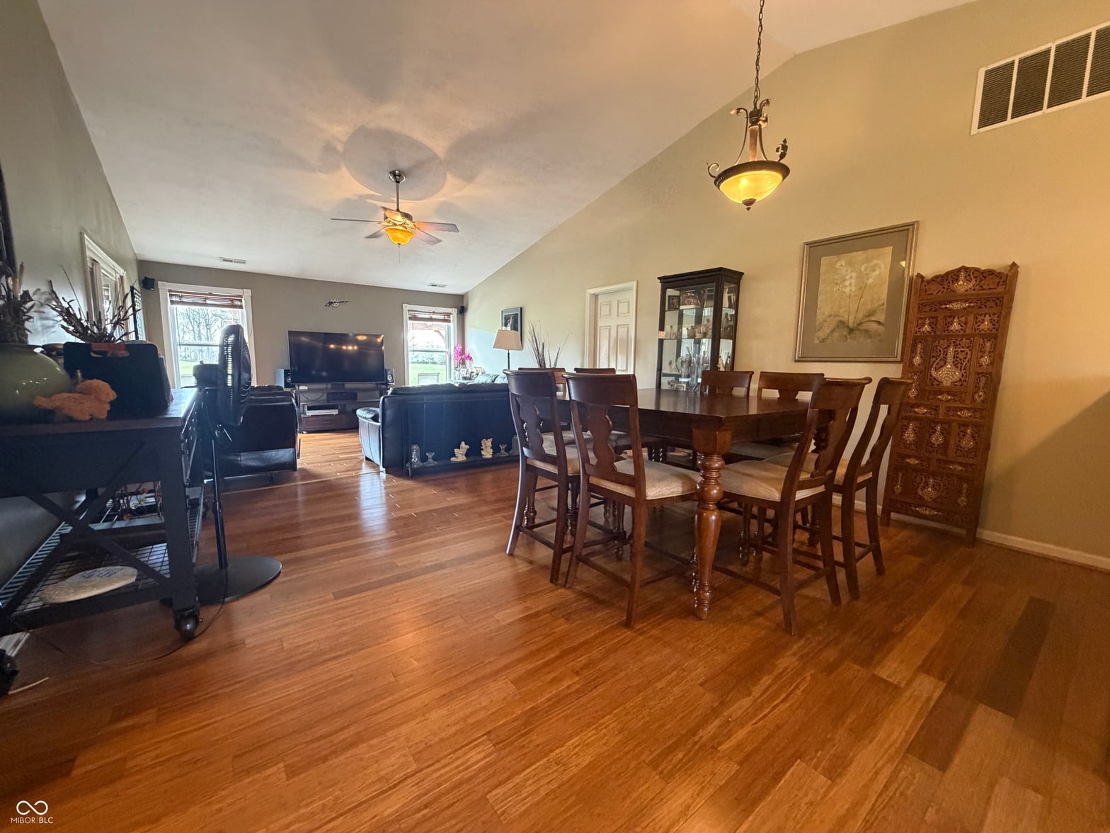 Spacious open living area with beautiful hardwood floors.