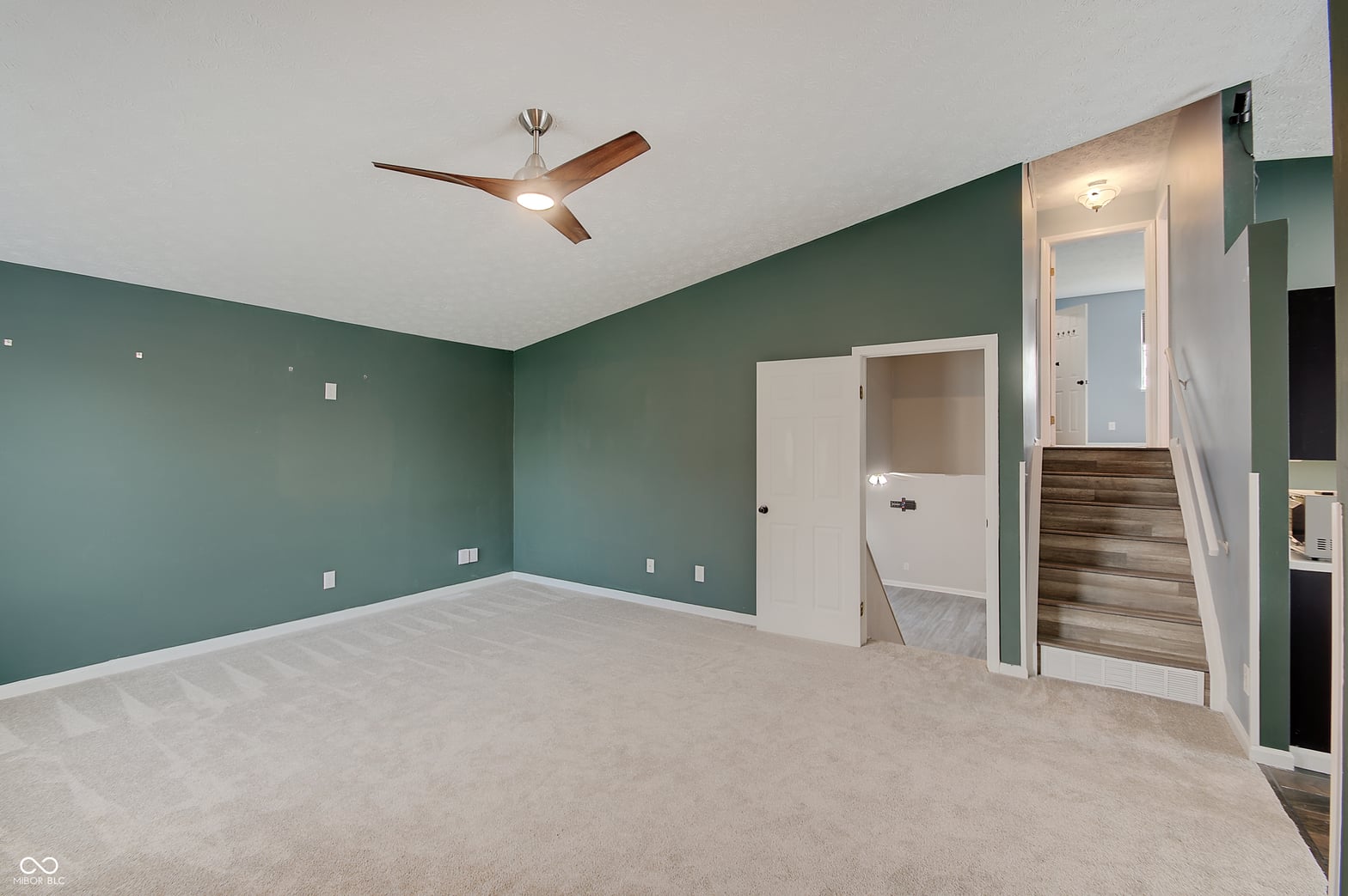 Spacious primary bedroom with ensuite and walk-in closet.