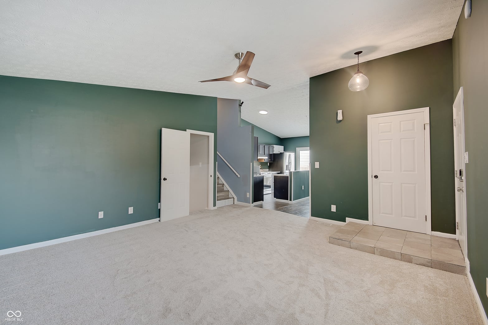 Spacious open family room with modern accent walls.