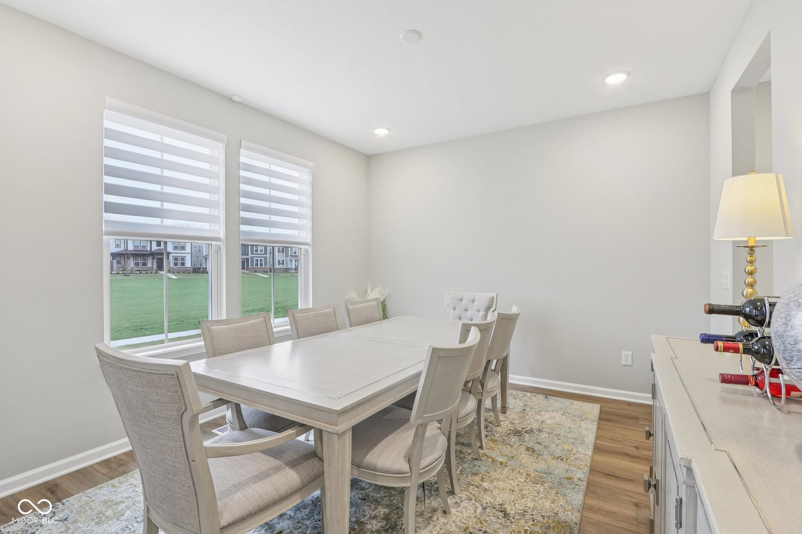 Bright, modern dining room with luxe finishes and outdoor views.