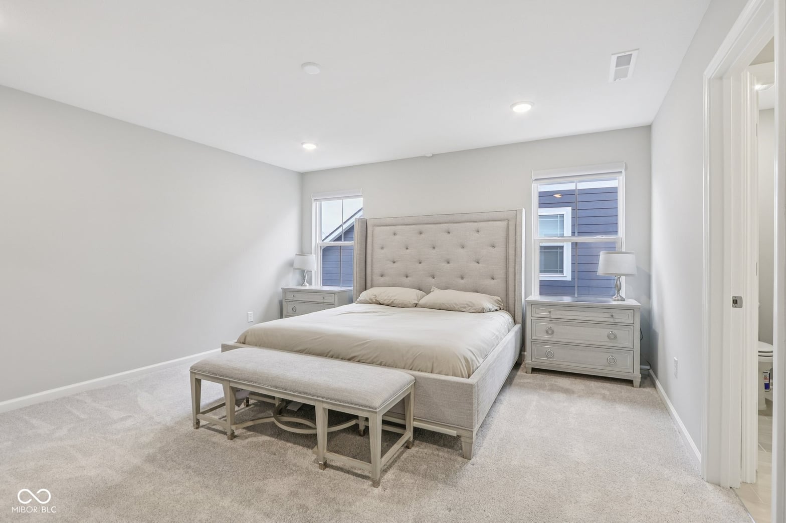 Bright, spacious primary bedroom with ensuite access.