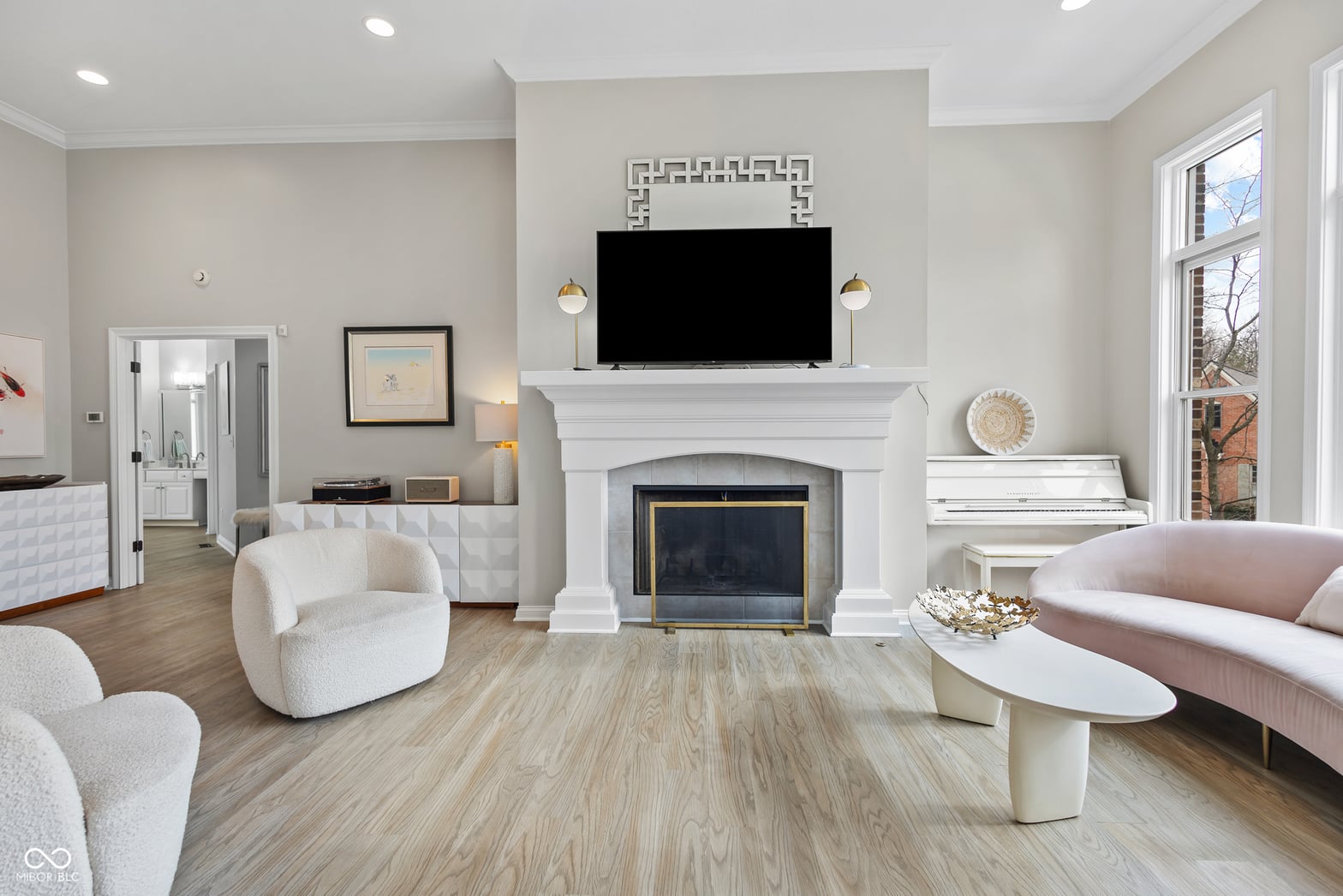 Luxurious primary suite with fireplace and ensuite.