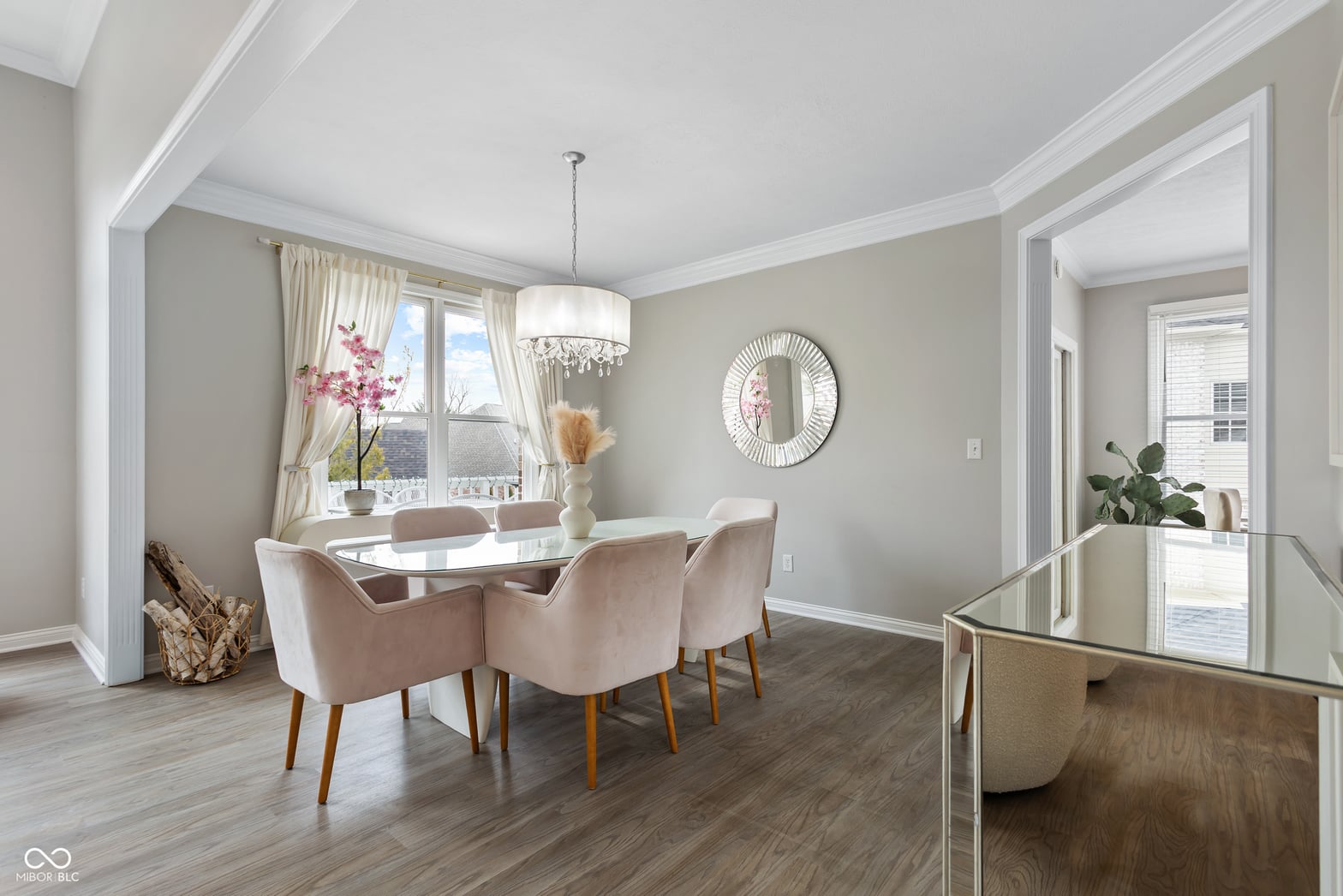 Bright contemporary dining room with hardwood floors and natural light.
