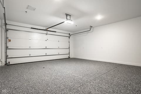 Garage at 717 Livingstone Drive, Carmel, IN — Clean, well-lit garage with durable epoxy flooring.