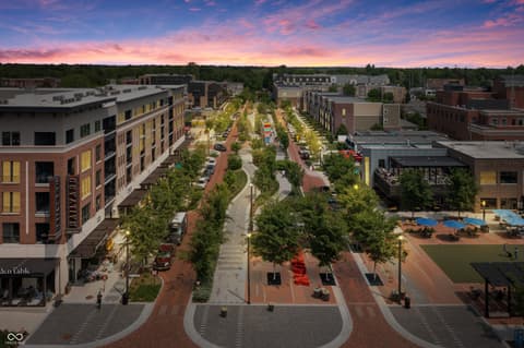 Aerial view at 717 Livingstone Drive, Carmel, IN — Stunning aerial view of vibrant mixed-use urban development.