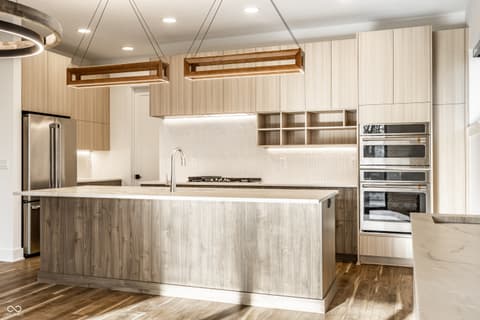 Kitchen at 717 Livingstone Drive, Carmel, IN — Luxurious chef's kitchen with premium appliances and island