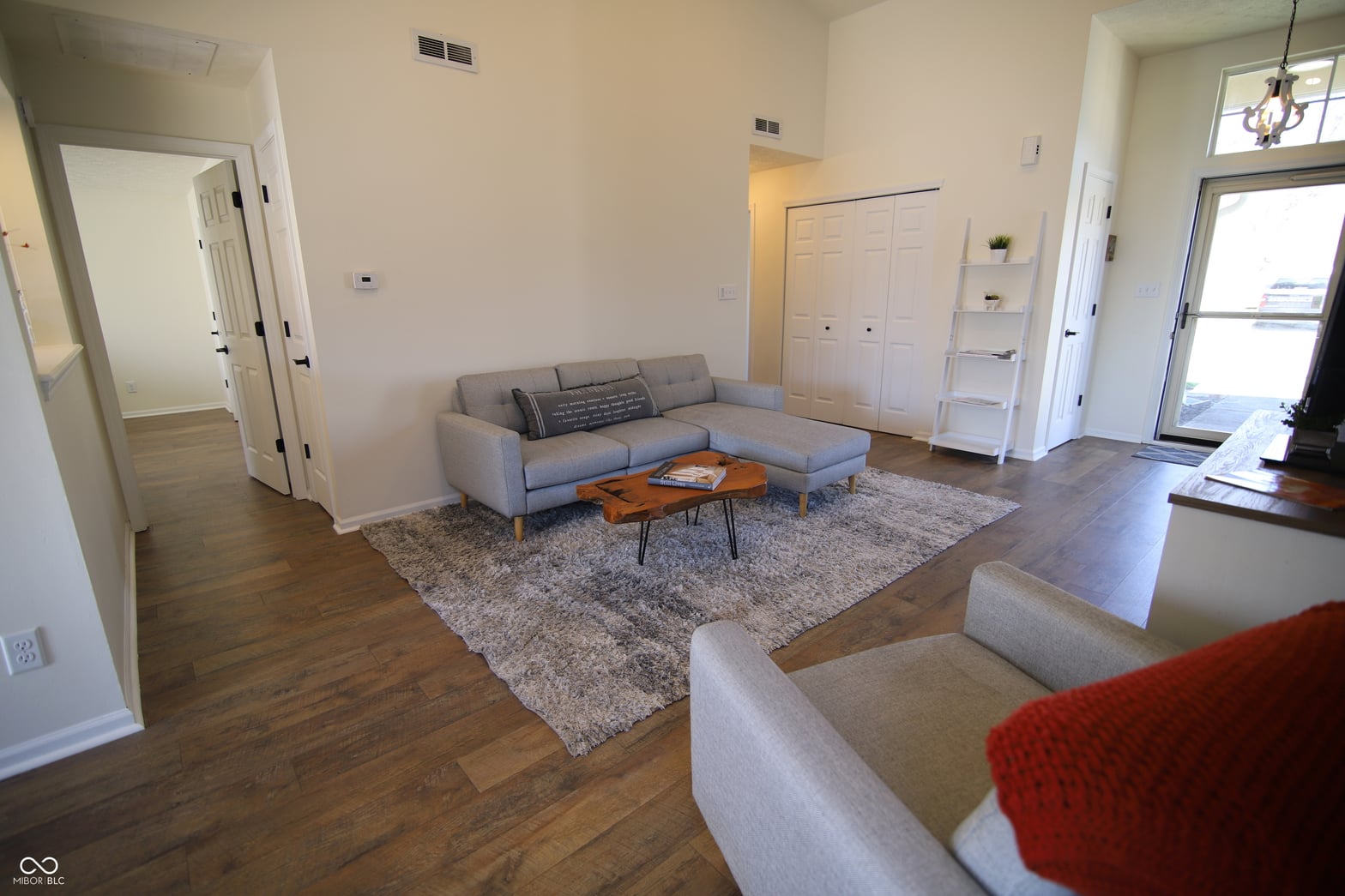 Bright modern living room with hardwood floors and natural light.
