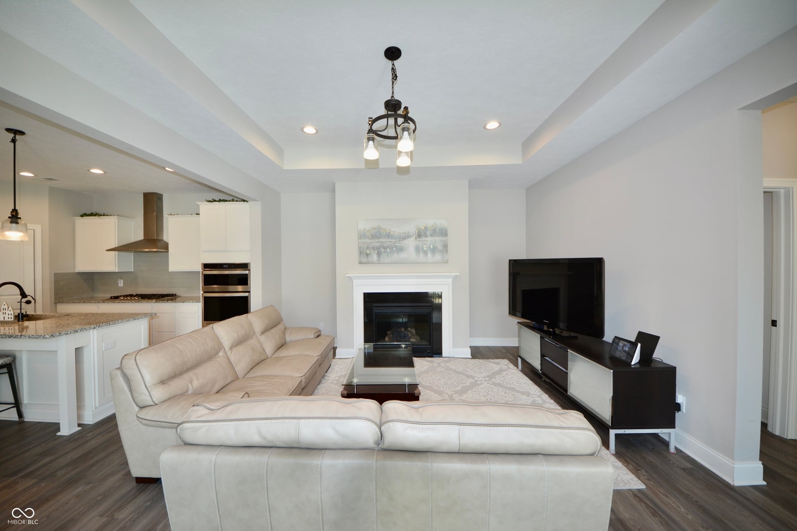 Elegant open-concept living with fireplace and designer finishes.