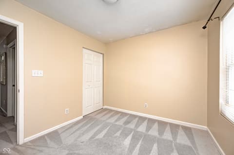 Bedroom at 12673 Ladson Street, Fishers, IN — Bright bedroom with updated carpet and fresh paint.