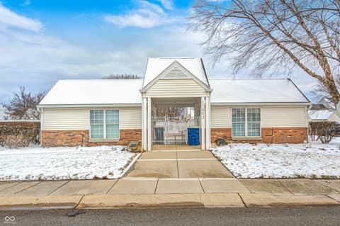 Front exterior at 12673 Ladson Street, Fishers, IN — Well-maintained ranch with welcoming covered entry porch.