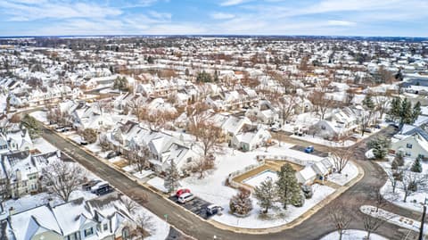Aerial view at 12673 Ladson Street, Fishers, IN — Aerial view of established suburban community with snow.