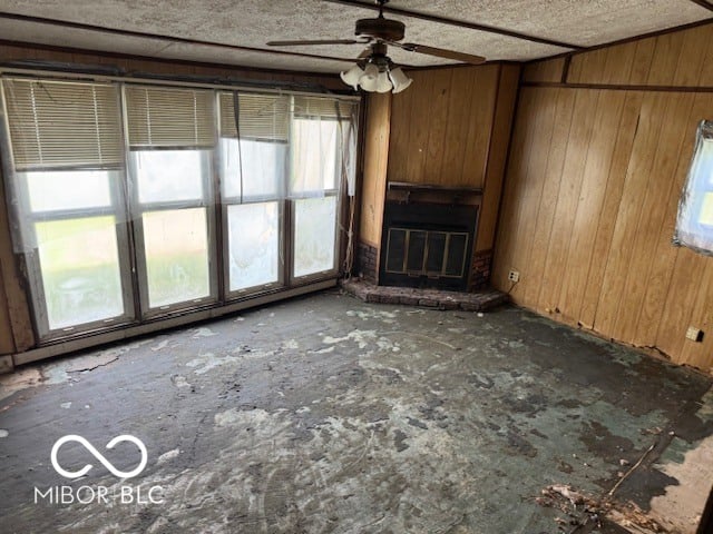 Spacious room with fireplace and glass doors needing updates.