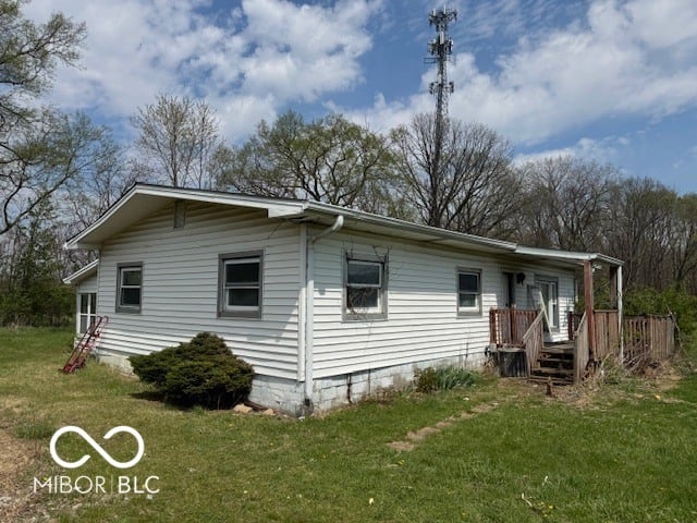 Single-wide mobile home on spacious wooded property.