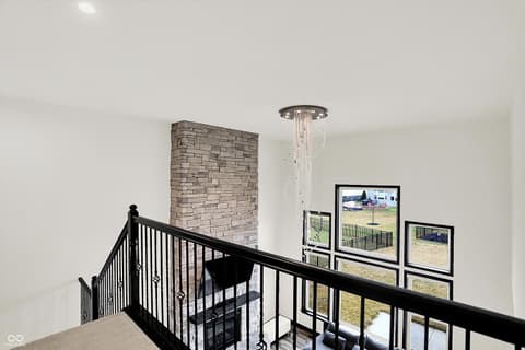 Foyer at 3565 Snowdon Drive, Westfield, IN — Dramatic two-story foyer with stone fireplace accent.