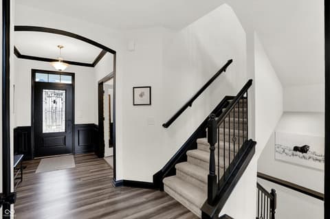 Foyer at 3565 Snowdon Drive, Westfield, IN — Stunning modern foyer with striking black and white details.