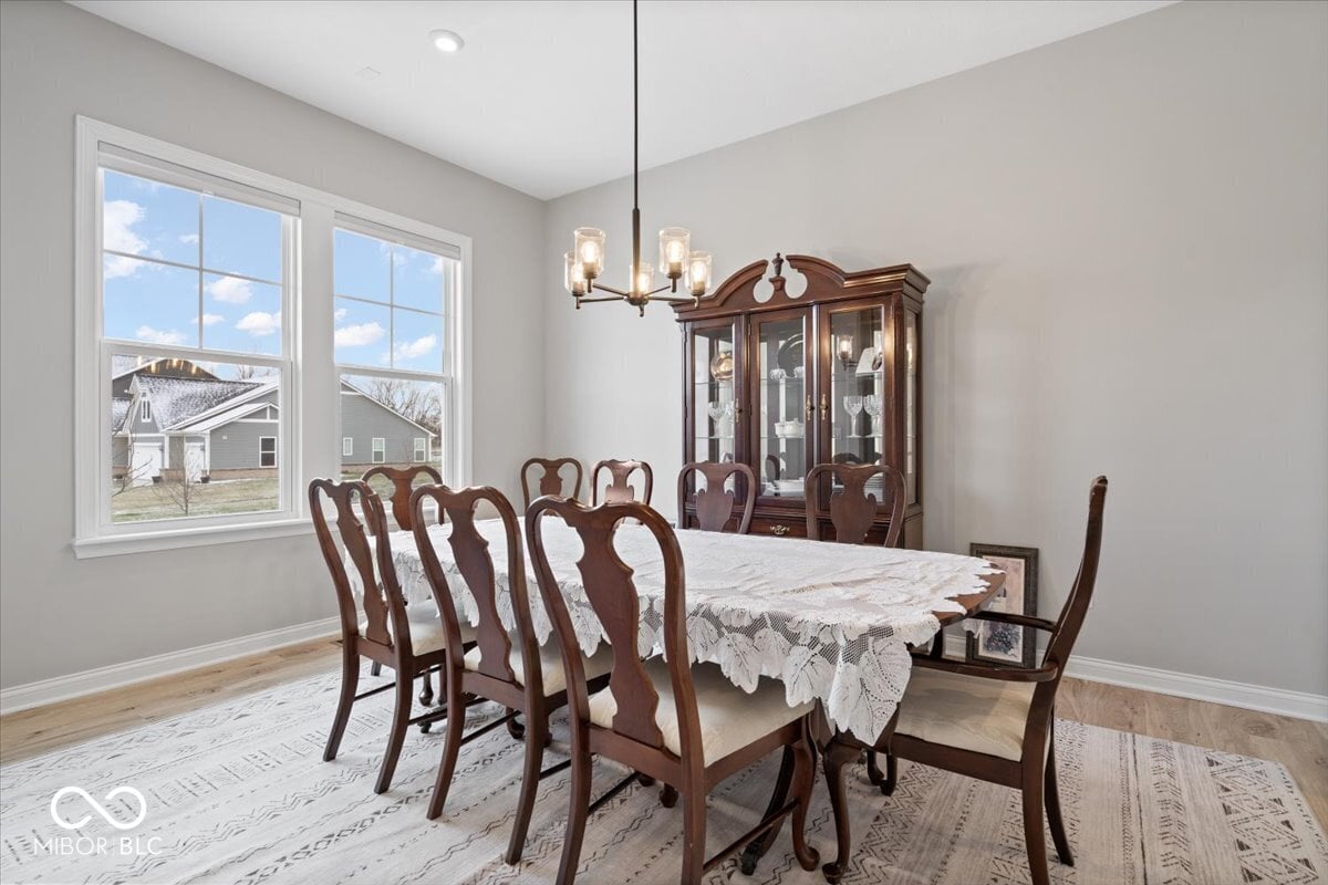 Elegant formal dining with abundant natural light and storage.
