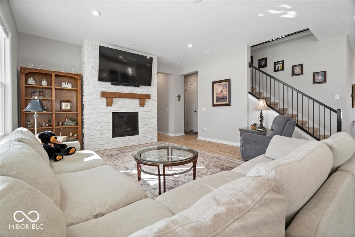 Modern family room with fireplace and open layout.