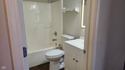 Bathroom at 18702 Planer Drive, Noblesville, IN — Clean, functional bathroom with tub and shower combo.