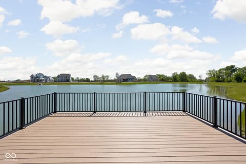 Outdoor living area at 17452 Carrier Drive, Westfield, IN — Stunning waterfront deck with panoramic lake views.
