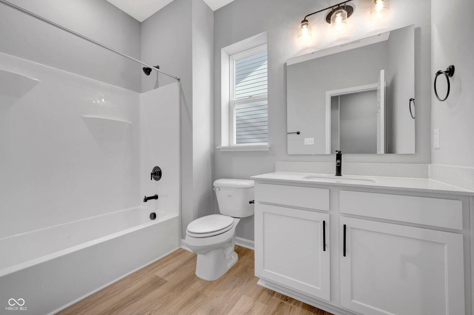 Bright, modern primary bath with dual sink vanity and shower.