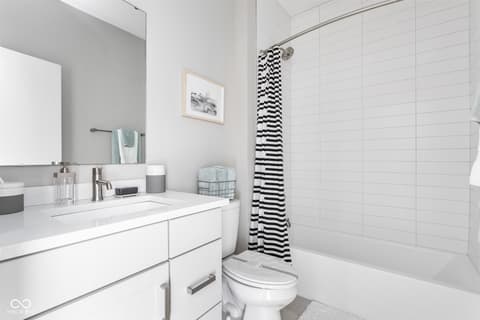 Primary bathroom at 11372 Nickel Row, Fishers, IN — Bright, clean modern bathroom with spacious soaking tub.